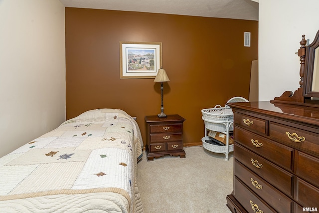 bedroom featuring light colored carpet and visible vents