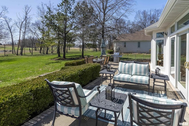 view of patio featuring outdoor lounge area and a grill
