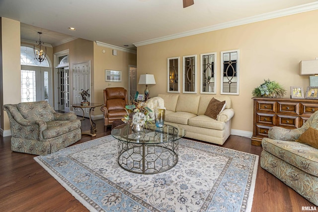 living area with ornamental molding, ceiling fan with notable chandelier, dark wood finished floors, recessed lighting, and baseboards