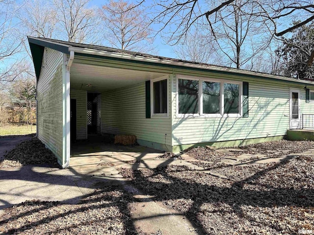 607 S Skyline Dr, Carbondale, IL 62901 - view of side of property with an attached carport and driveway