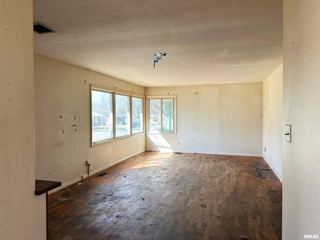 607 S Skyline Dr, Carbondale, IL 62901 - unfurnished room featuring visible vents, baseboards, and hardwood / wood-style flooring