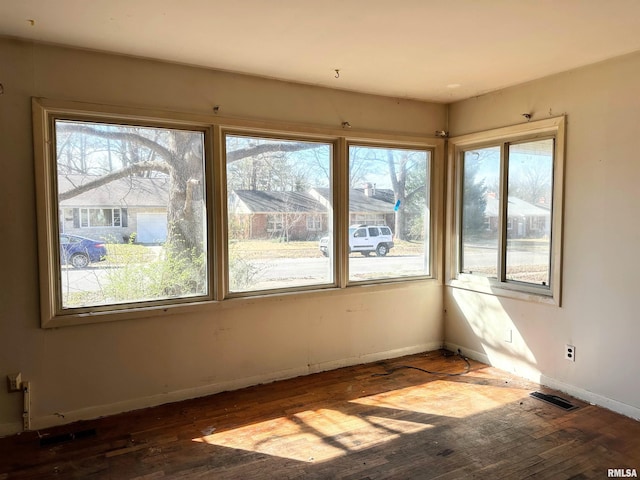 607 S Skyline Dr, Carbondale, IL 62901 - spare room featuring baseboards, wood-type flooring, and visible vents