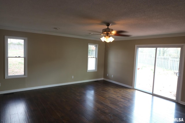 914 Valley Dr, Carterville, IL 62918 - spare room featuring baseboards, ceiling fan, dark wood finished floors, and crown molding
