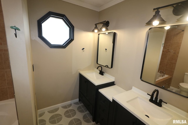 914 Valley Dr, Carterville, IL 62918 - bathroom featuring two vanities, toilet, crown molding, and a sink