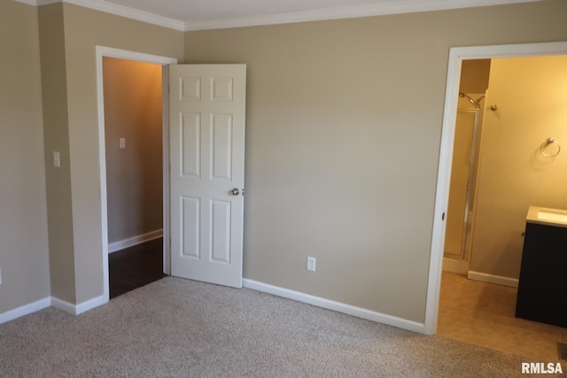 914 Valley Dr, Carterville, IL 62918 - unfurnished bedroom featuring ornamental molding, carpet floors, and baseboards