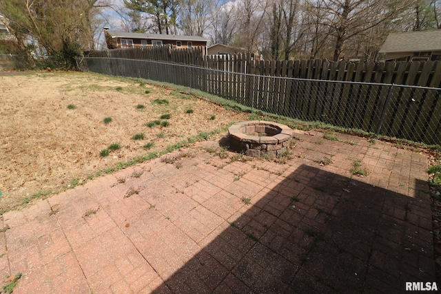 914 Valley Dr, Carterville, IL 62918 - view of yard featuring a fire pit, a fenced backyard, and a patio area