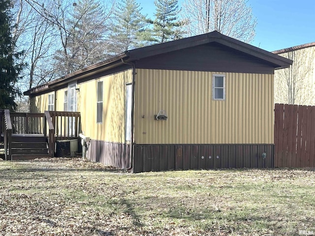 view of property exterior featuring fence