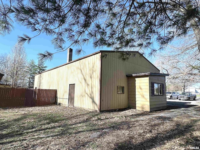view of outdoor structure with fence