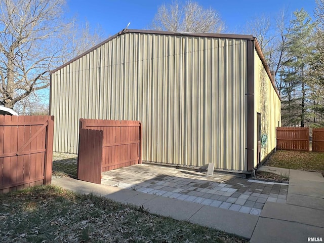 view of outbuilding with fence