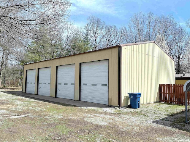 detached garage with fence