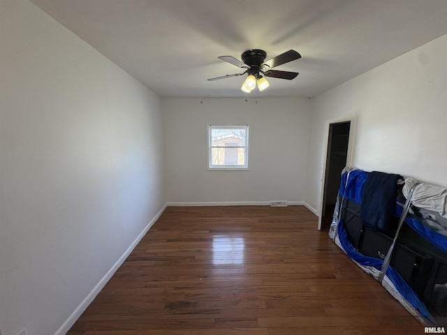 710 S Maple St, Cambria, IL 62915 - empty room featuring ceiling fan, baseboards, and wood finished floors