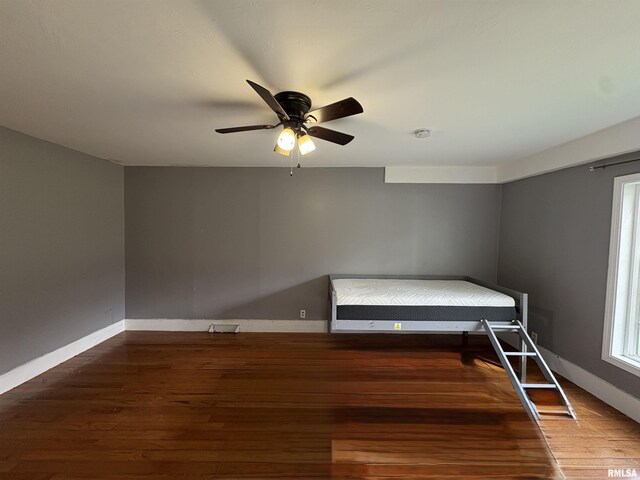 710 S Maple St, Cambria, IL 62915 - unfurnished bedroom with ceiling fan, baseboards, and wood finished floors