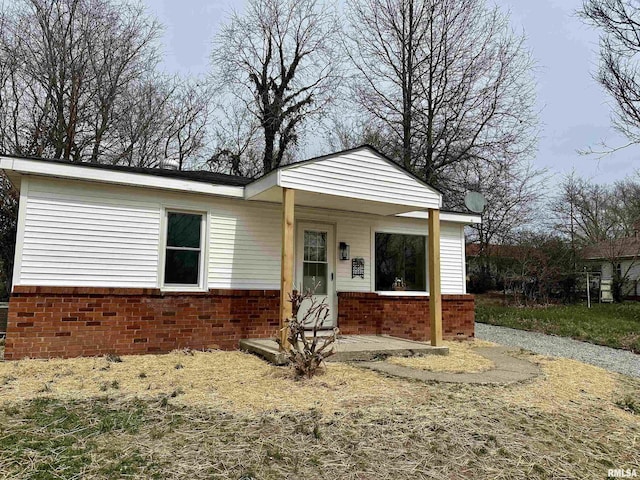 view of front of house with brick siding