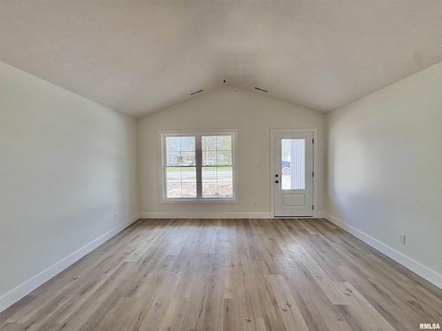 209 Madison St, Cambria, IL 62915 - entryway with wood finished floors, lofted ceiling, and baseboards