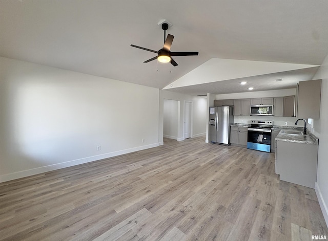 209 Madison St, Cambria, IL 62915 - unfurnished living room featuring ceiling fan, a sink, light wood finished floors, baseboards, and high vaulted ceiling