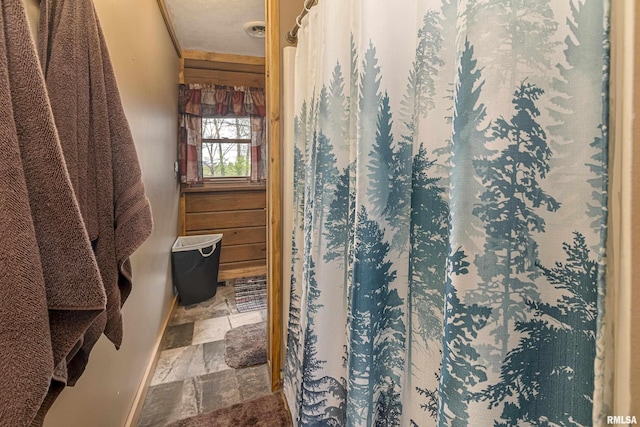 320 Nelson Ln, Grantsburg, IL 62943 - bathroom featuring baseboards and stone tile flooring