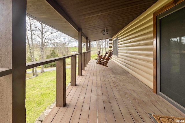 320 Nelson Ln, Grantsburg, IL 62943 - deck featuring covered porch and a yard