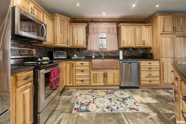 320 Nelson Ln, Grantsburg, IL 62943 - kitchen with a toaster, tasteful backsplash, appliances with stainless steel finishes, a sink, and stone tile floors