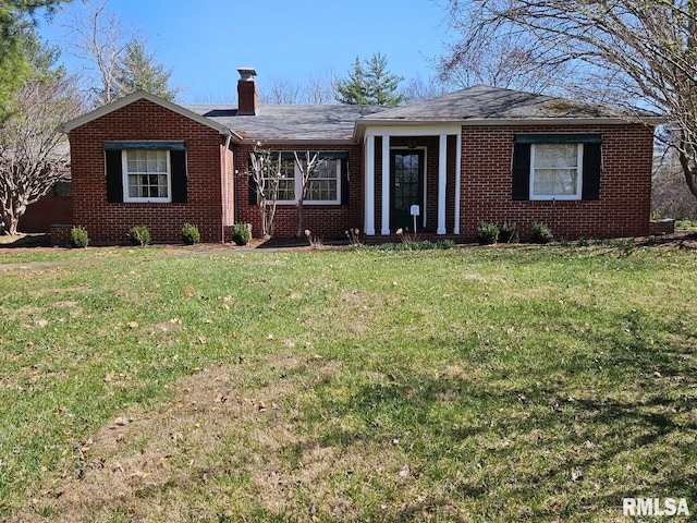 ranch-style house with a front lawn, a chimney, and brick siding