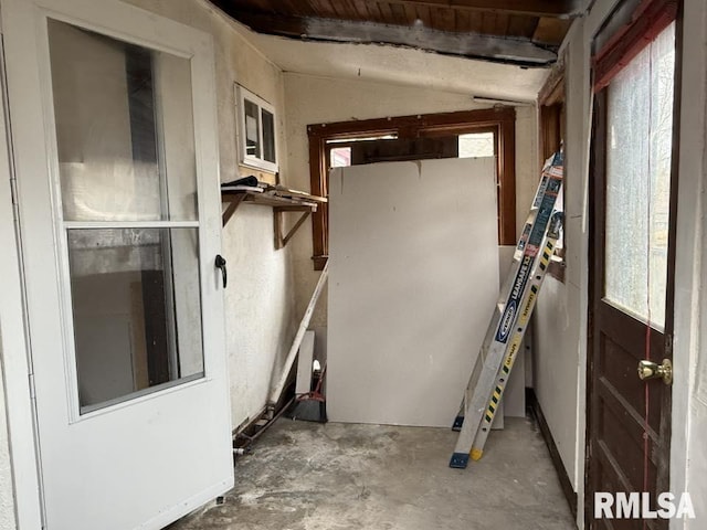 interior space with concrete floors and lofted ceiling