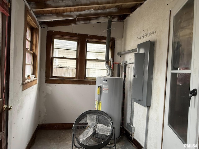 utility room with gas water heater and electric panel