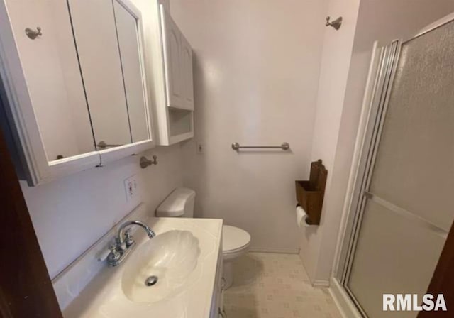full bath with a shower stall, toilet, and vanity