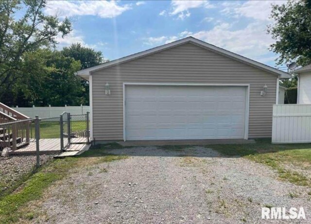 detached garage with fence