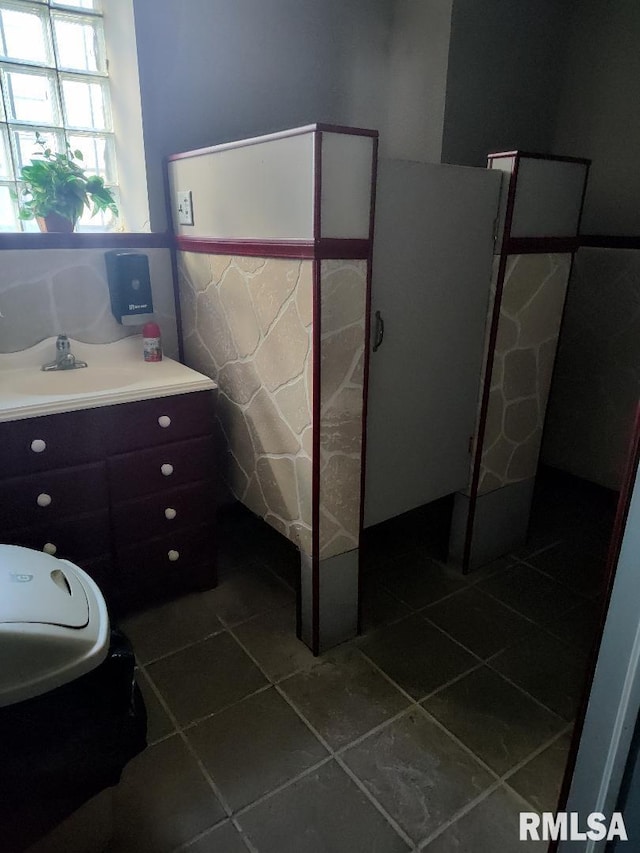 bathroom with tile patterned flooring and a sink