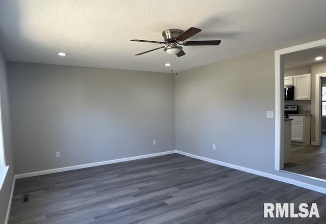 spare room featuring dark wood finished floors, recessed lighting, baseboards, and ceiling fan