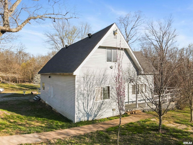 125 Central Hill Rd, Grantsburg, IL 62943 - view of side of home featuring a shingled roof and a yard