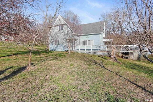 125 Central Hill Rd, Grantsburg, IL 62943 - back of house with a lawn, a wooden deck, and roof with shingles