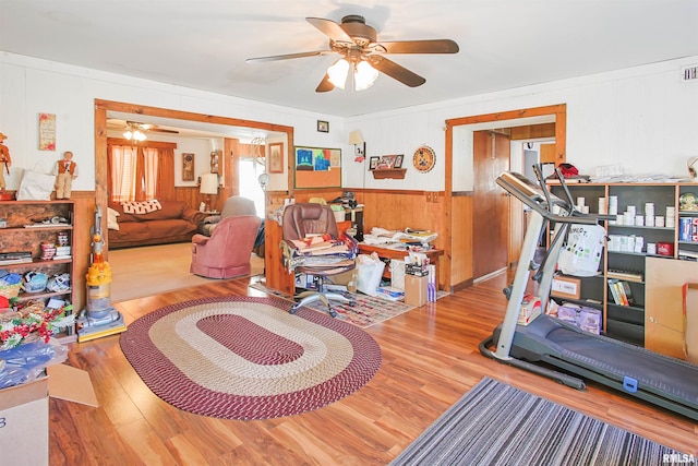 125 Central Hill Rd, Grantsburg, IL 62943 - exercise area featuring visible vents, ceiling fan, wood finished floors, and wainscoting