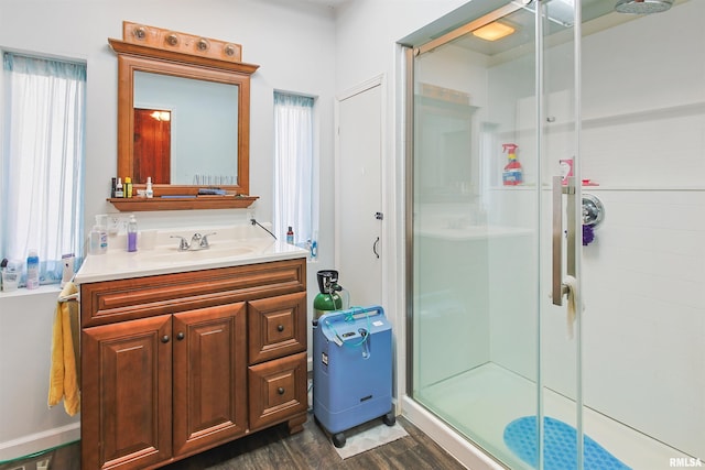 125 Central Hill Rd, Grantsburg, IL 62943 - full bathroom with wood finished floors, vanity, and a shower stall