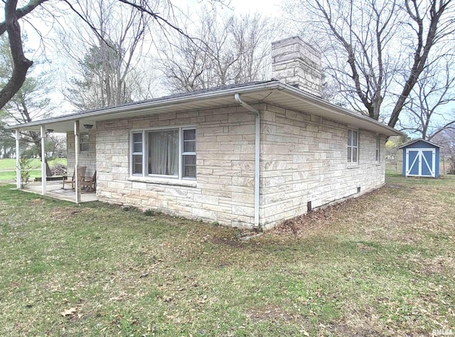 view of side of home with an outdoor structure, a chimney, stone siding, a yard, and a storage shed