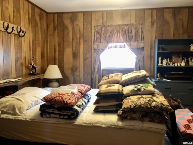bedroom with wood walls