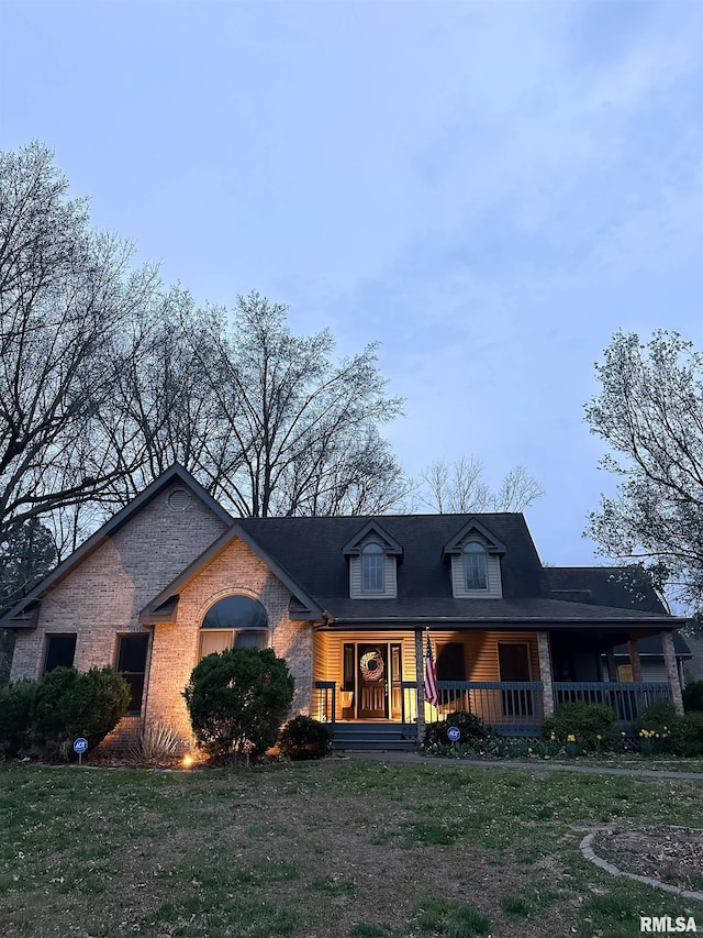 701 Rachael Ct, Carterville, IL 62918 - view of front of house featuring a front lawn, a porch, and brick siding