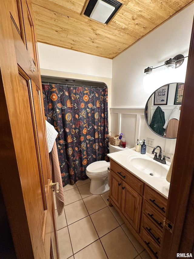 701 Rachael Ct, Carterville, IL 62918 - full bath featuring wainscoting, toilet, vanity, tile patterned flooring, and wooden ceiling