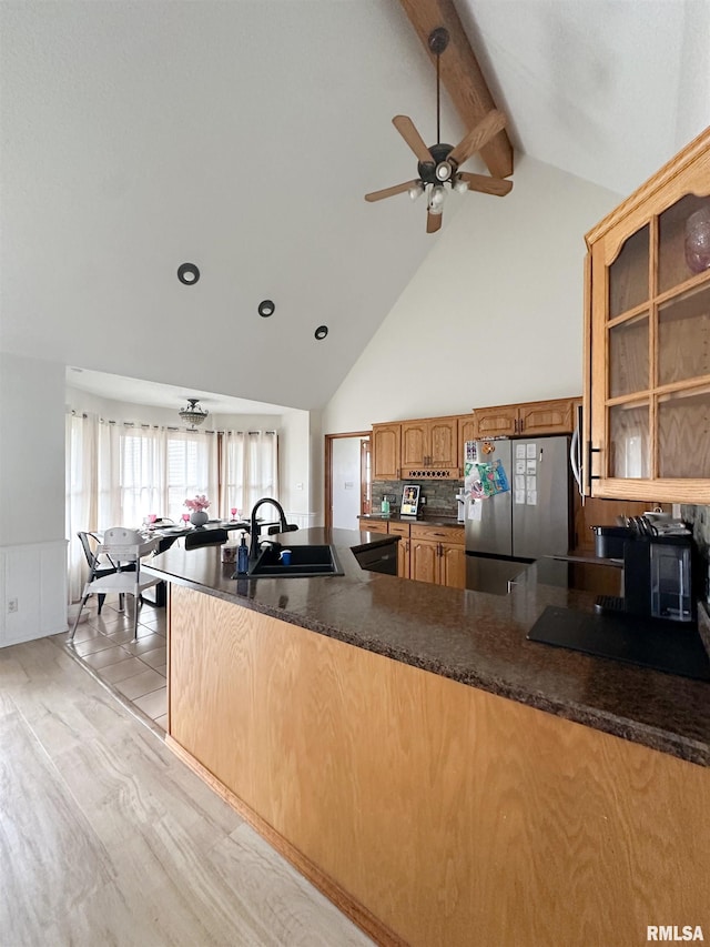 701 Rachael Ct, Carterville, IL 62918 - kitchen with a sink, freestanding refrigerator, dark countertops, beamed ceiling, and ceiling fan
