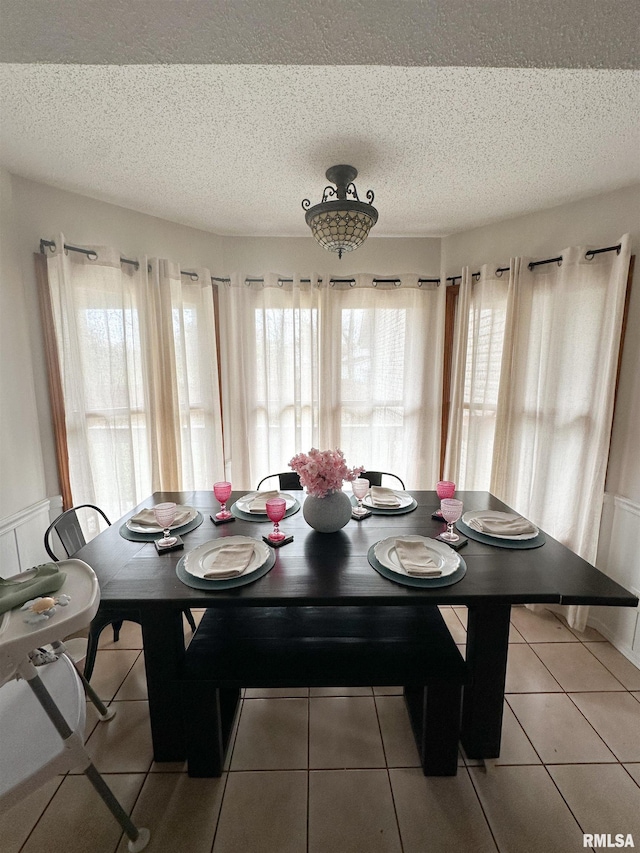 701 Rachael Ct, Carterville, IL 62918 - dining space with a textured ceiling and light tile patterned floors