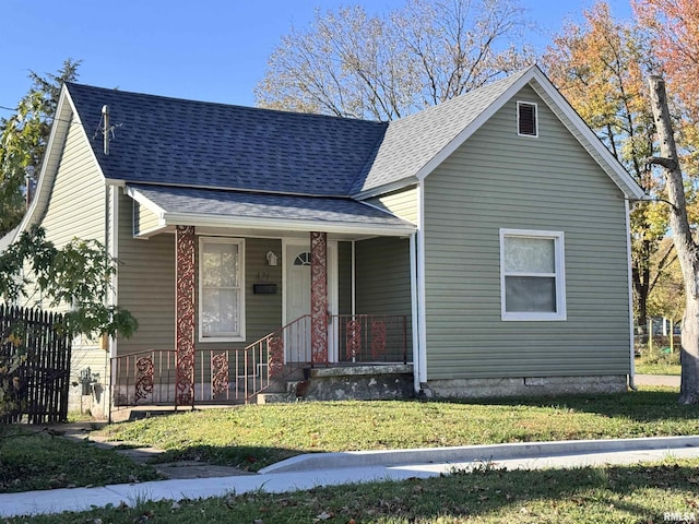 421 N 18th St, Herrin, IL 62948 - view of front of property with a front yard, covered porch, fence, and roof with shingles