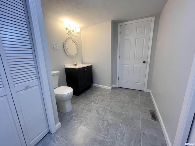 421 N 18th St, Herrin, IL 62948 - bathroom featuring vanity and a textured ceiling