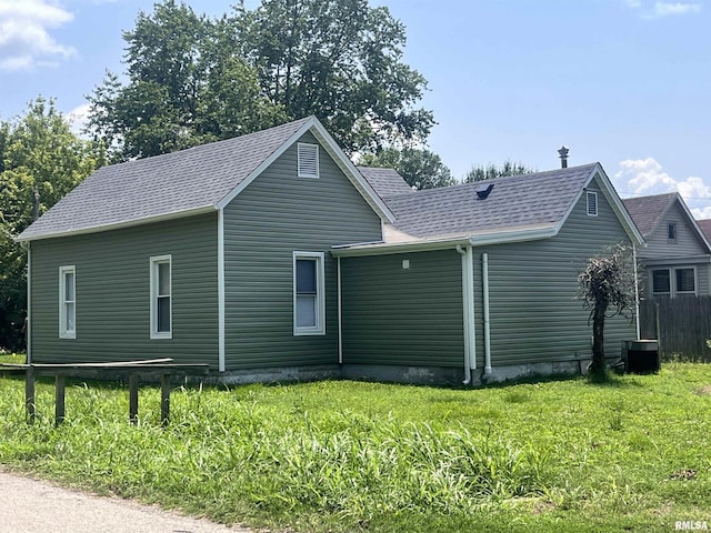 421 N 18th St, Herrin, IL 62948 - view of home's exterior featuring a yard and roof with shingles