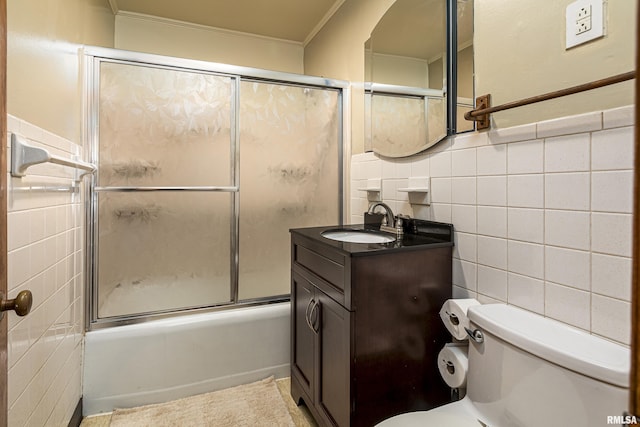 804 N Almond St, Carbondale, IL 62902 - full bathroom featuring shower / bath combination with glass door, vanity, crown molding, tile walls, and toilet