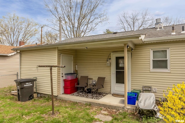 804 N Almond St, Carbondale, IL 62902 - rear view of house featuring a shingled roof and a patio area