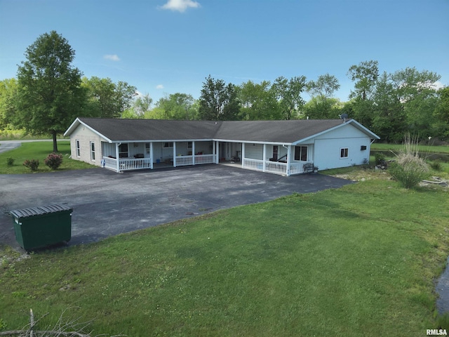 7979 State Route 14th Hwy, Duquoin, IL 62832 - ranch-style home featuring asphalt driveway, a porch, a front lawn, and a carport