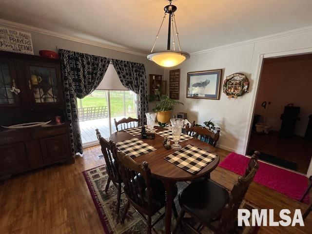 188 W Honeysuckle Dr, Elizabethtown, IL 62931 - dining area featuring ornamental molding and wood finished floors