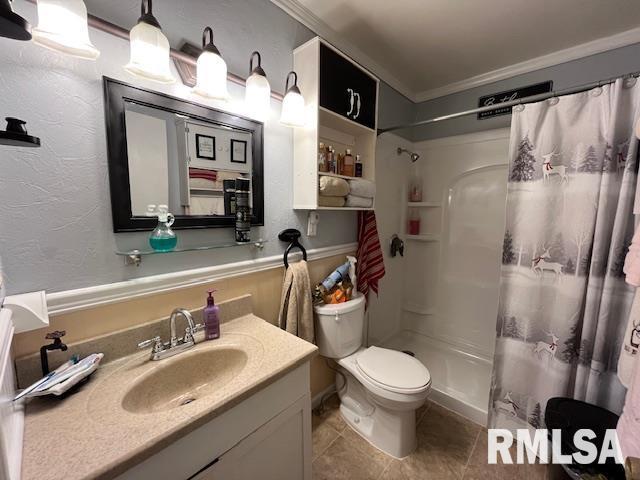 188 W Honeysuckle Dr, Elizabethtown, IL 62931 - bathroom featuring crown molding, toilet, tile patterned floors, vanity, and a shower with curtain