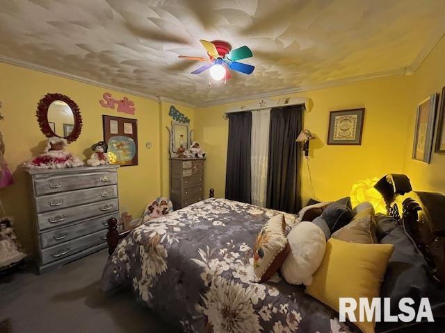 188 W Honeysuckle Dr, Elizabethtown, IL 62931 - bedroom with carpet, ceiling fan, and ornamental molding