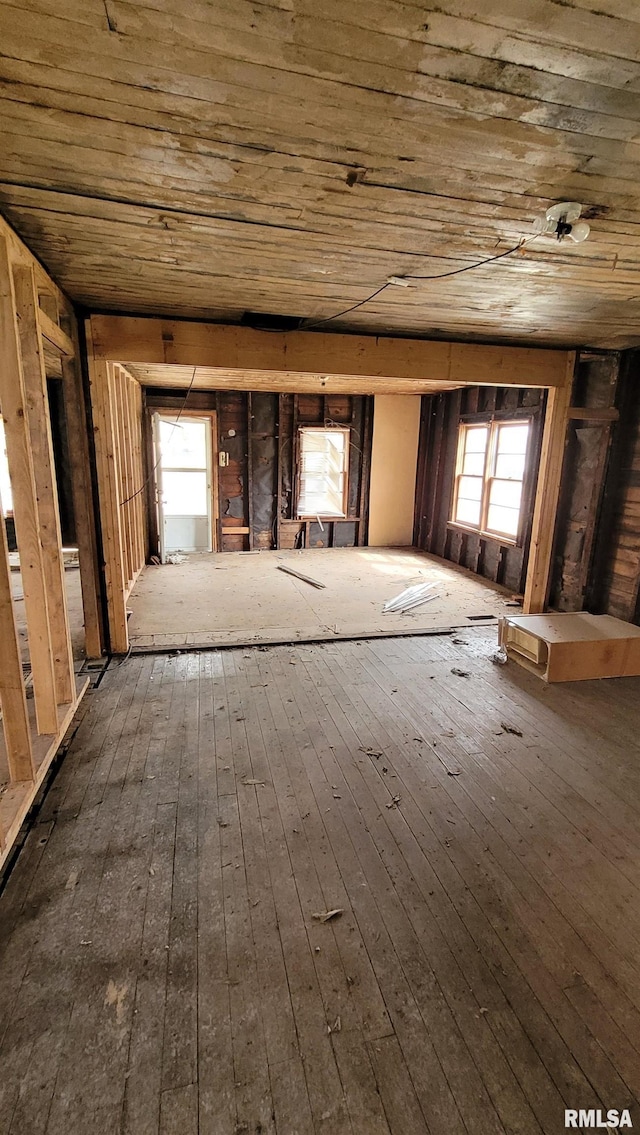 miscellaneous room featuring wood ceiling and dark wood-style flooring