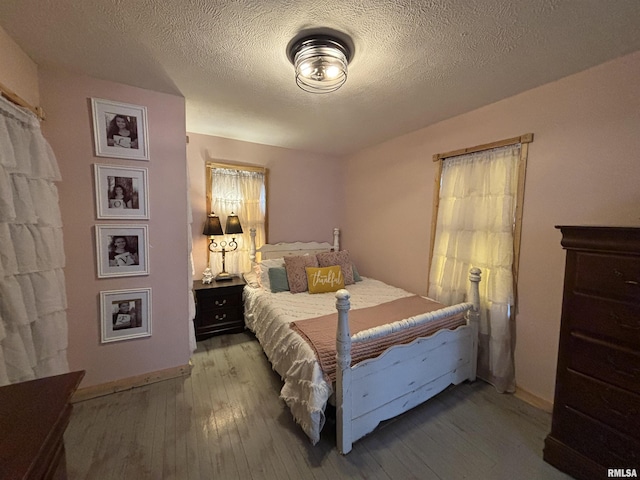 205 N Bentley St, Marion, IL 62959 - bedroom featuring hardwood / wood-style floors and a textured ceiling